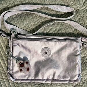 Kipling metallic lavender crossbody like new. Purse for everyday great to travel